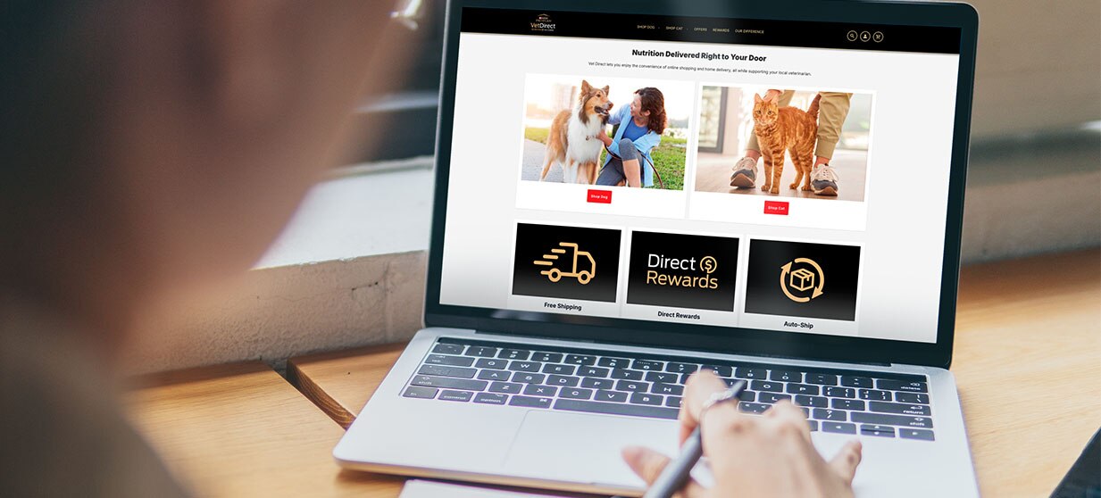 Person on Pro Plan Vet Direct home page on their laptop.