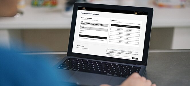 Individual on Purina for Professionals login page on their laptop.